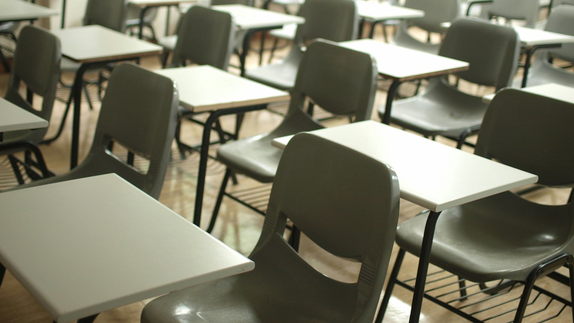 Empty classroom with desks and chairs